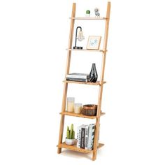 a wooden shelf with books and other items on it, against a white background that is also used as a shelving unit