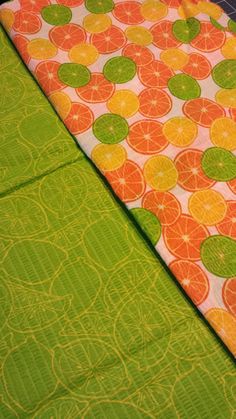 an orange and green table cloth with circles on it