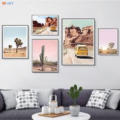 a living room filled with furniture and pictures hanging on the wall above a coffee table