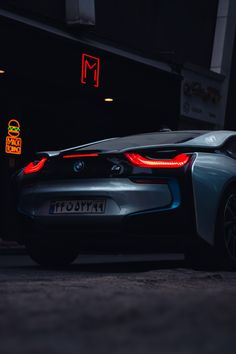 a car parked on the street at night