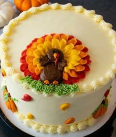 a decorated cake with a turkey on top