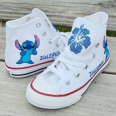 Stitch and her name on each shoe al9ng with hibiscus flowers in glittery blue on the tongues. Choose your size and color during checkout. Converse Design, Lilo And Stitch Merchandise, Lilo And Stitch Quotes, Pretty Sneakers, Cute Nike Outfits, Stitch Clothes, Custom Converse, Disney Shoes, Cute Stitch