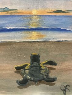 a painting of a turtle on the beach