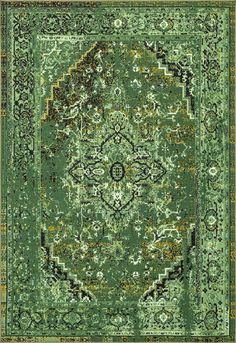 a green rug with an ornate design on the top and bottom, in different colors