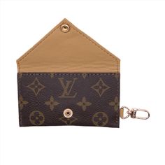 a brown and black card holder with a keychain hanging from it's side