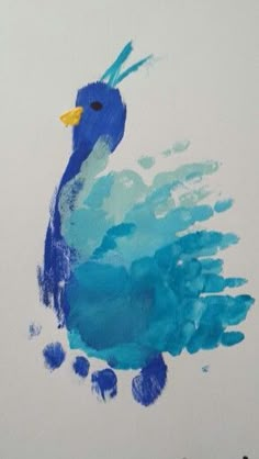 a painting of a blue bird on a white background with watercolors in the foreground