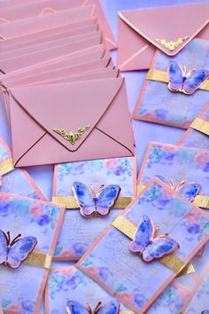 pink and gold envelopes with butterflies on them