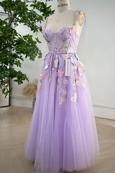 Elevate your style with our stunning Embroidery Floral Corset Lavender Dress. Featuring intricate floral embroidery and removable tie straps, this dress exudes elegance and charm. The corset design cinches the waist for a flattering silhouette, making it the perfect addition to your wardrobe. Make a statement at any event with this luxurious dress. Bust and Skirt with full lining. 100% Polyester 100% Recycled polyester lining Concealed zip at centre back Imported Luxurious Dress, Satin Corset Dress, Corset Design, Lavender Dress, Luxurious Dresses, Dress Corset, Floral Corset, Lavender Dresses, Satin Corset