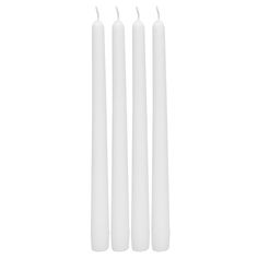 three white candles sitting next to each other