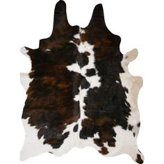 a brown and white cowhide rug with black spots on the bottom, in front of a white background