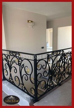 an iron balcony railing with decorative designs on the balconies and handrails