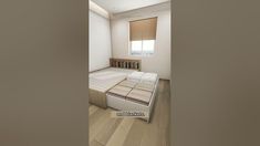 this is an image of a bedroom with white walls and wood flooring, as well as a bed