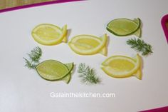 cut up lemons and herbs on a cutting board