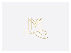 the letter m in gold on a white background