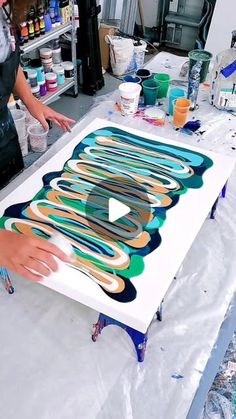 a woman working on an art project in her studio