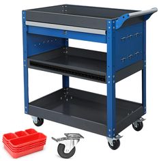 a blue utility cart with two red trays on the bottom and one empty plastic container next to it