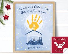 a christmas card with the birth of jesus and handprint on it, surrounded by holly branches