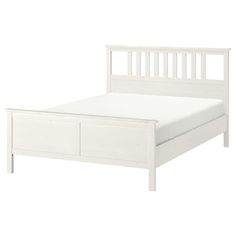 a white bed frame with two drawers on each side and no headboard or foot board