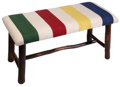 a bench with multi colored stripes on it