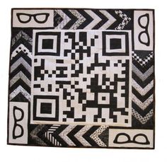 a black and white quilt with an interesting design