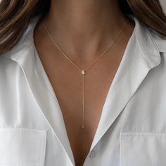 "A great layering necklace, this dainty lariat necklace is chic & stylish! A perfect piece for a night out! - - - D E T A I L S - - -  * Made of 925 Sterling Silver * We use a THICK plating of 14k Gold or Rhodium  * 16\" + 3\" Extension Chain  * 3\" long y-chain with bezel at the bottom * Pear Shaped CZ - we use the highest grade for an authentic diamond look!  * Nickel-free & Hypoallergenic  🎁 Comes in a gift-box, ready for gift giving!  ✈️ Ships same day for fast delivery!  ♡ Made with 100% Pure Love!  🥰 Happy to answer any questions you may have!  🤗 Let's Connect!  IG: samijewels_" Luxury Delicate Drop Necklace In Yellow Gold, Luxury Lariat Diamond Necklace With Delicate Chain, Luxury Diamond Classic Lariat Necklace, Minimalist Adjustable Layered Clavicle Necklace, Adjustable Lariat Drop Necklace In Minimalist Style, Minimalist Adjustable Lariat Drop Necklace, Adjustable Minimalist Lariat Drop Necklace, Minimalist Layered Necklace With Adjustable Delicate Chain, Minimalist Lariat Necklace With Clavicle Chain For Layering