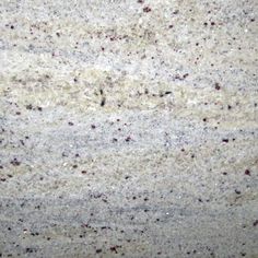 a close up view of the surface of a granite countertop with red and white speckles