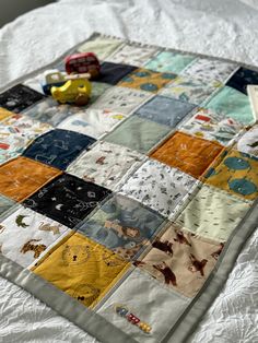 a close up of a quilt on a bed