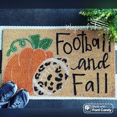 a door mat that says footjoy and fall with a pumpkin on it next to a pair of shoes