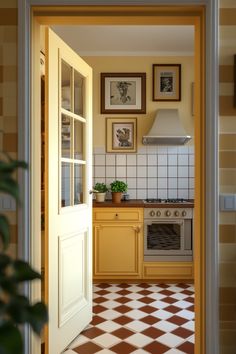 an open door leading to a kitchen with checkered tile flooring and yellow cabinets