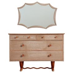 a dresser with a mirror above it and a wooden drawer below it on a white background