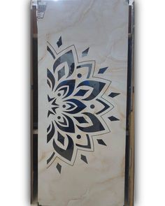 a white and black tile with an intricate design on it