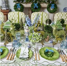 the table is set with dishes and place settings