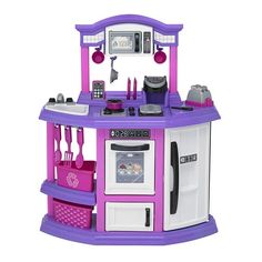 a purple and white kitchen playset with lots of accessories