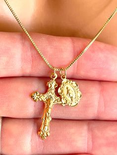 This is a beautiful gold or silver double charm necklace featuring a 16k gold over 925 sterling silver Italian style crucifix cross pendant alongside a 16k gold over a small 925 sterling silver Mother Mary miraculous medallion.  Both pendants come together on a 1mm 14k gold-filled box chain. This is an incredible piece of heirloom jewelry for women!  These gorgeous charms are made by master silversmiths here in the USA.  Such attention to detail these charms are so exquisite that the photos do n Gold Crucifix Necklace, Heirloom Jewelry, Crucifix Necklace, Small Necklace, Heirlooms Jewelry, Catholic Jewelry, Dope Jewelry, Miraculous Medal, Stacked Jewelry