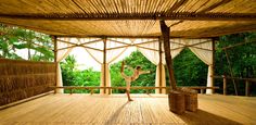 a person doing yoga on a wooden deck