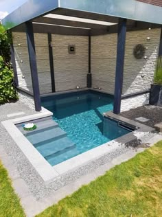 an outdoor swimming pool with a gazebo in the middle