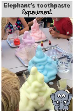 children are sitting at a table with different colored soaps in the shape of trees