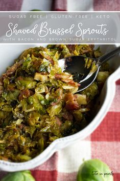 a white dish filled with brussel sprouts and bacon