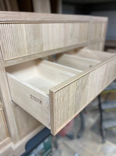 an unfinished cabinet drawer is shown in this image