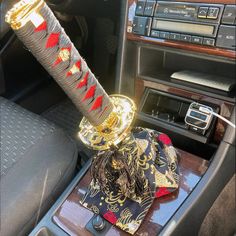 a car dashboard with an elaborately decorated steering wheel knob