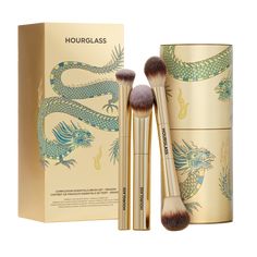 Meet the ultimate complexion-perfecting trio: an assortment of our most coveted complexion brushes. Available in a limited-edition gold finish exclusively for Holiday 2024, these multi-tasking brushes come packaged in a custom-designed tin canister featuring artwork by London illustrator Katie Scott. Brushes Included: Ambient Soft Glow Foundation Brush – Designed to mimic the delicate and precise control of the fingertips, this cruelty-free brush features unique vegan fiber technology and custom bristles for effortless blending and intuitive, even application. Vanish Seamless Finish Concealer Brush - A high-performance concealer brush that delivers unprecedented precision and blending, featuring a unique half-moon shape for controlled application to the contours of the face, especially und Katie Scott, Hourglass Makeup, Holiday Beauty, Glow Foundation, Free Brush, Concealer Brush, Luxury Makeup, Beauty Gift Sets, Foundation Brush