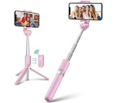 a pink selfie stick is being used to take pictures with two people in the background