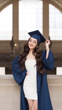 a woman wearing a graduation cap and gown