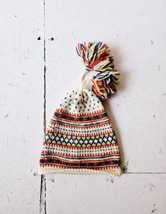 A vintage 1970s hand knit fair isle wool pom pom hat. *label: n/a *hat is wool *excellent condition! *No size tag. Hat opening measures 17 1/2"-20" / 44.5 cm-51 cm (flat-stretched) in circumference. Hat measures 9 1/4" / 23.5 cm opening to top of hat. RETURN POLICY: Please be aware that while I do accept returns, I accept them *only* when the item does not match my description. I do NOT accept returns for items that do not fit. HOW SIZING WORKS: Sizing varies greatly era to era, manufacturer to manufacturer, and even garment to garment. I provide a modern day *estimate* of the size of vintage garments in my shop, but the best way to determine fit is to compare the measurements given in the description with those of a similar style garment that does fit. more vintage accessories || https:// Beanie Pom Pom, Hat Wool, Wool Beanie, Pom Pom Hat, Vintage Accessories, Fair Isle, Vintage Shops, Hand Knitting, Caps Hats