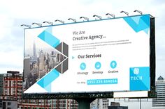 a large billboard on the side of a road in front of some buildings and skyscrapers