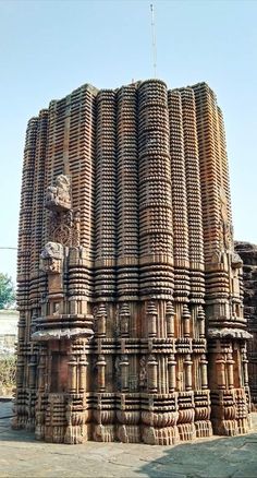 an intricately carved wooden structure in india