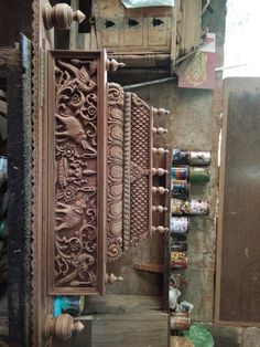 an intricately carved wooden door is open