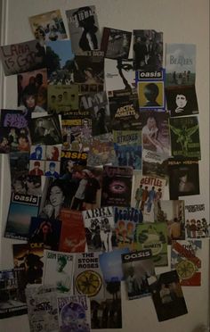 a refrigerator covered in lots of magnets and pictures