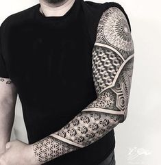 a man with a tattoo on his arm