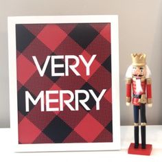 a christmas card with a nutcracker figure next to it